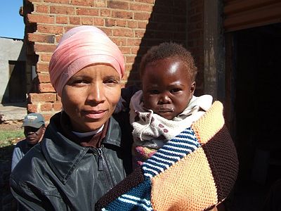 Gladys my co-worker with the child with no name - a blanket to keep him warm